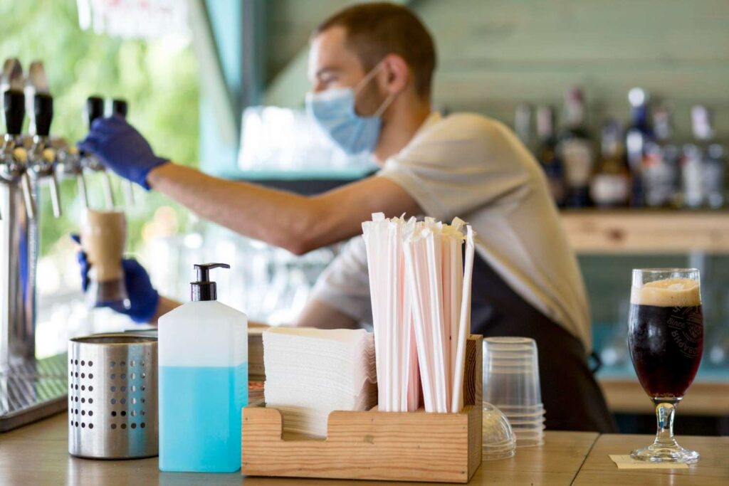 Close-up of clogged dishwasher spray arms and tips for cleaning them.
