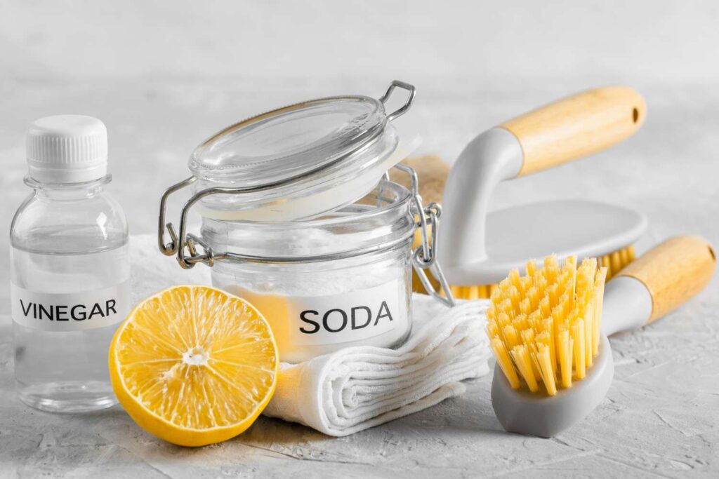adding baking soda to washing machine drum to remove bad odors