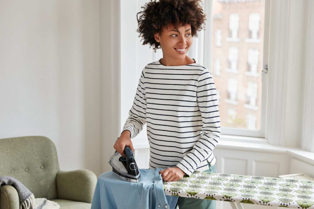 Compact travel steamer packed in suitcase for wrinkle-free travel clothes