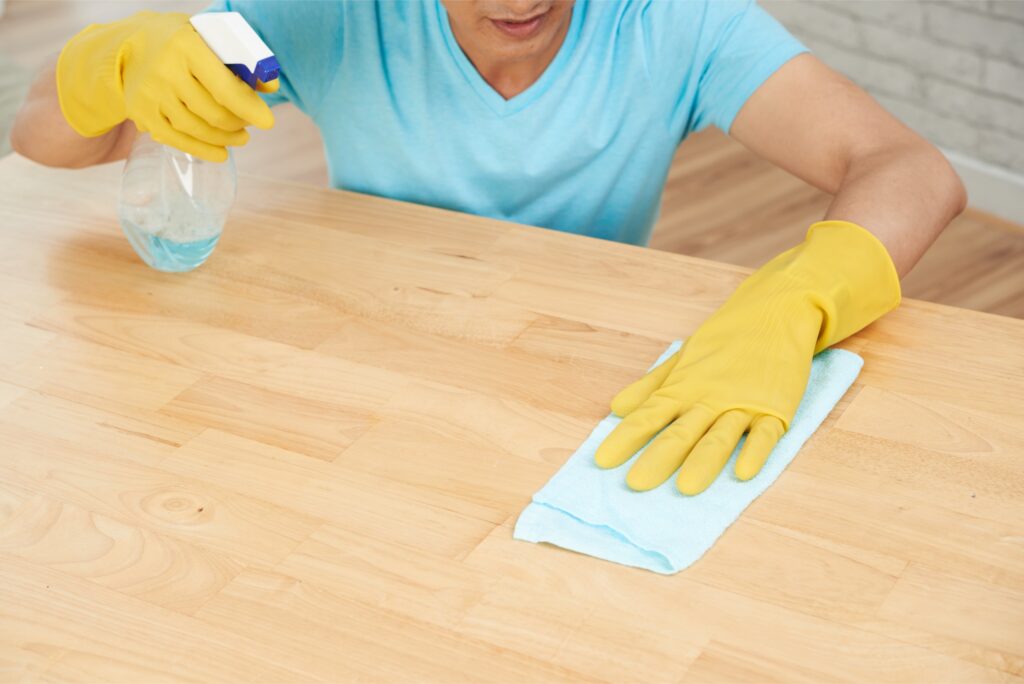 cleaning wooden table surface before applying scratch repair solution